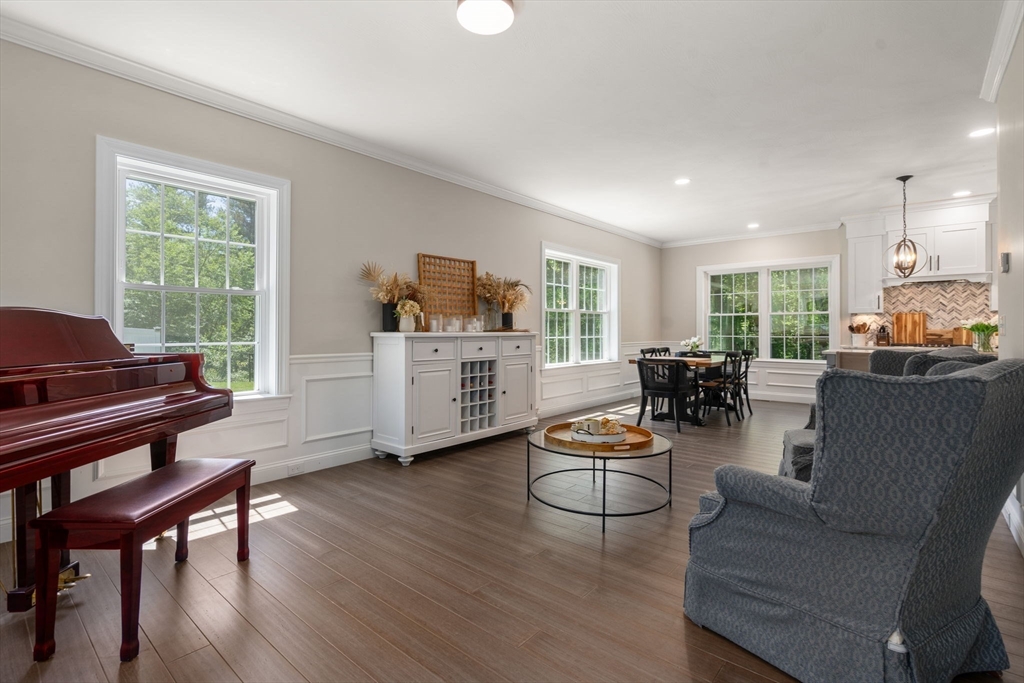 275 Chestnut Street Hudson, MA 01749 - Photo 5 of 34 a living room with furniture and a wooden floor