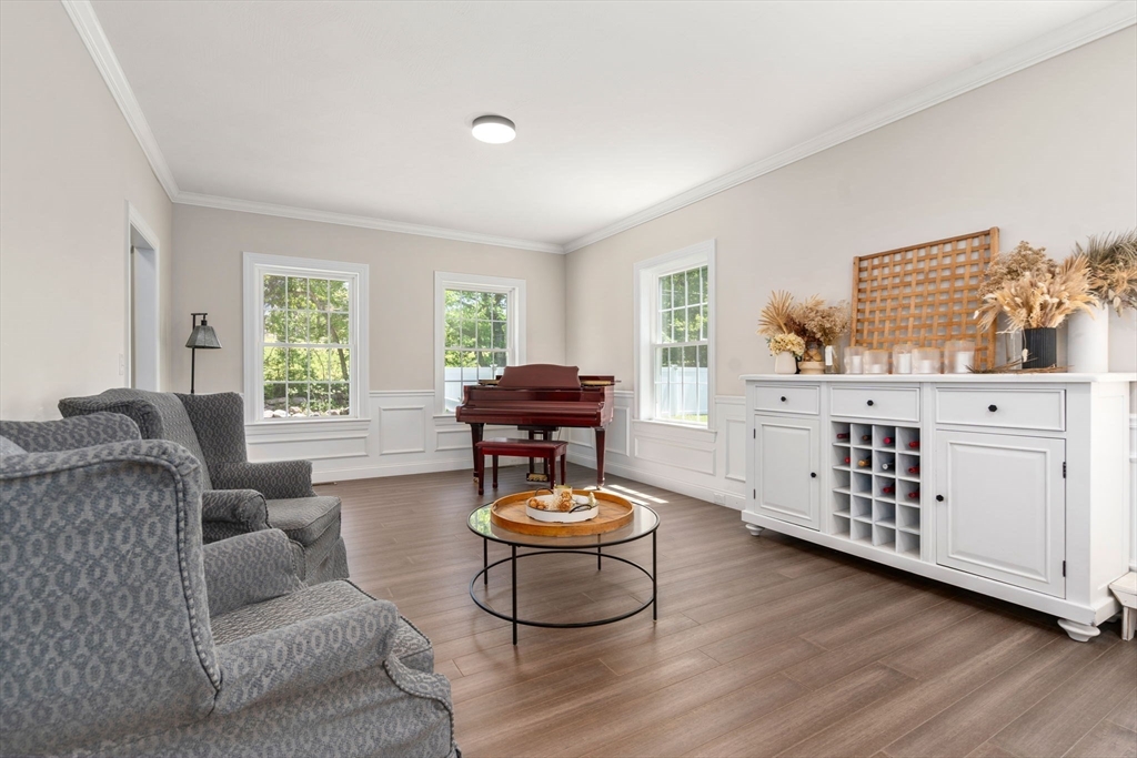 275 Chestnut Street Hudson, MA 01749 - Photo 6 of 34 a living room with furniture a window and a dresser