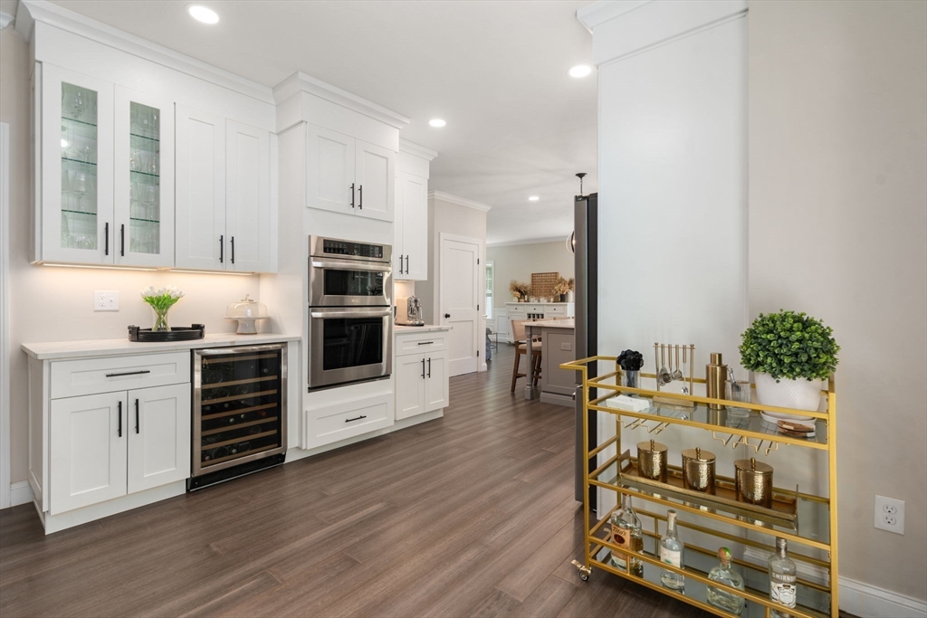 275 Chestnut Street Hudson, MA 01749 - Photo 7 of 34 a kitchen with microwave a stove and cabinets