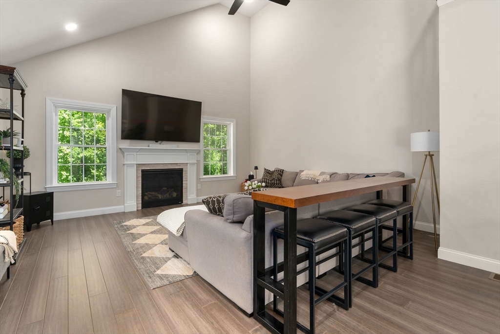 275 Chestnut Street Hudson, MA 01749 - Photo 10 of 34 a view of a livingroom with furniture and a fireplace