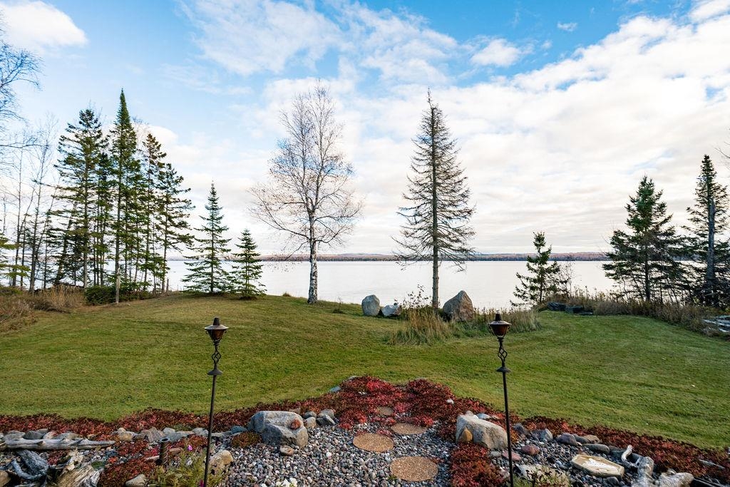 90190 Bark Point Road Herbster, WI 54844 - Photo 23 of 42 View of green lawn with a water view
