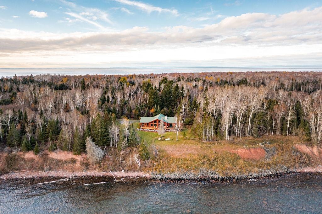 90190 Bark Point Road Herbster, WI 54844 - Photo 28 of 42 View of subject property featuring a large body of water and a heavily wooded area