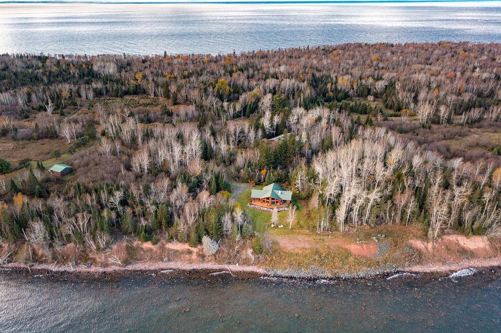 90190 Bark Point Road Herbster, WI 54844 - Photo 30 of 42 Aerial view of property and surrounding area featuring a large body of water and a heavily wooded area