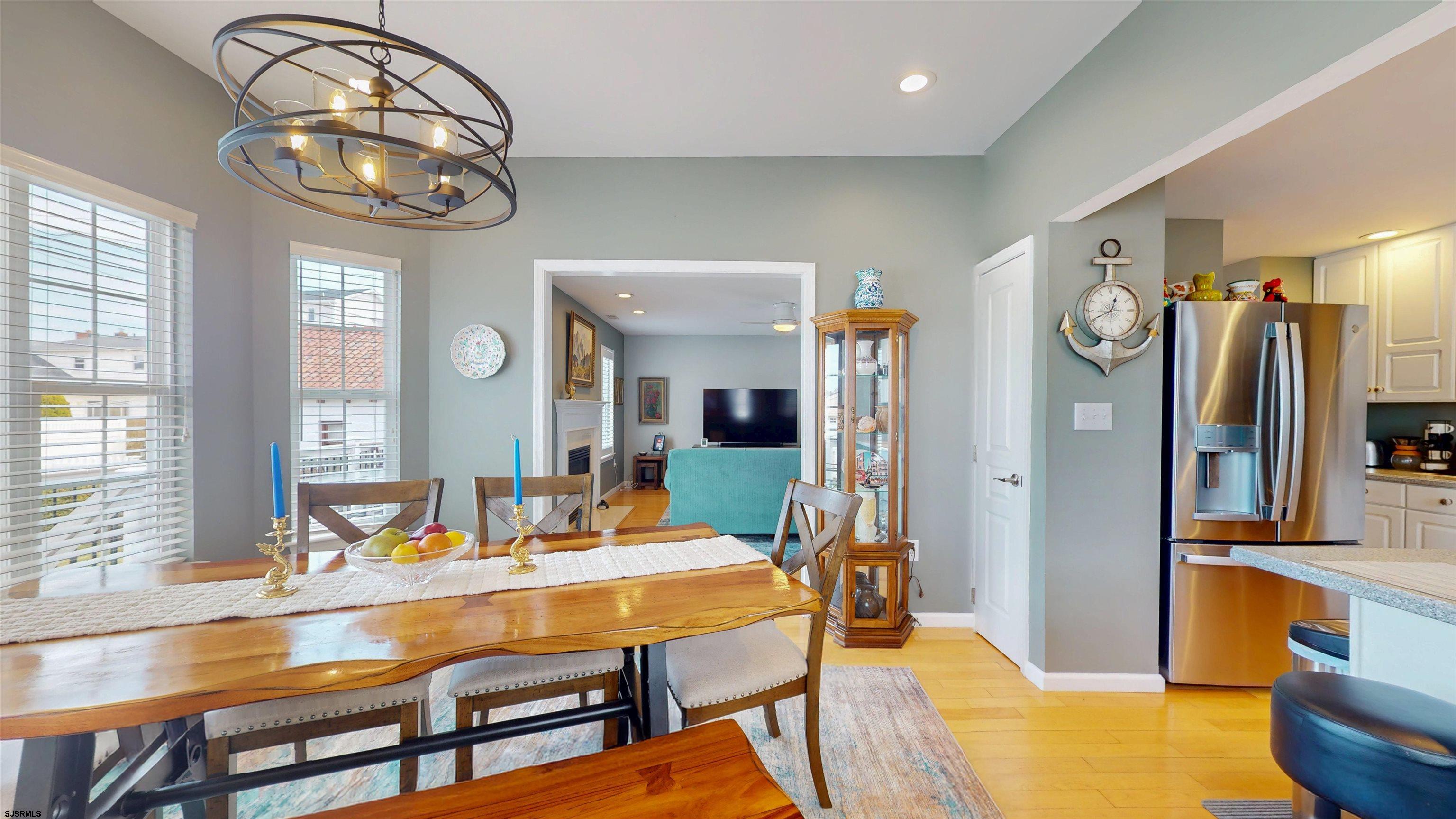 201 25th Street South Brigantine, NJ 08203 - Photo 11 of 60 a view of a dining room with furniture and a chandelier