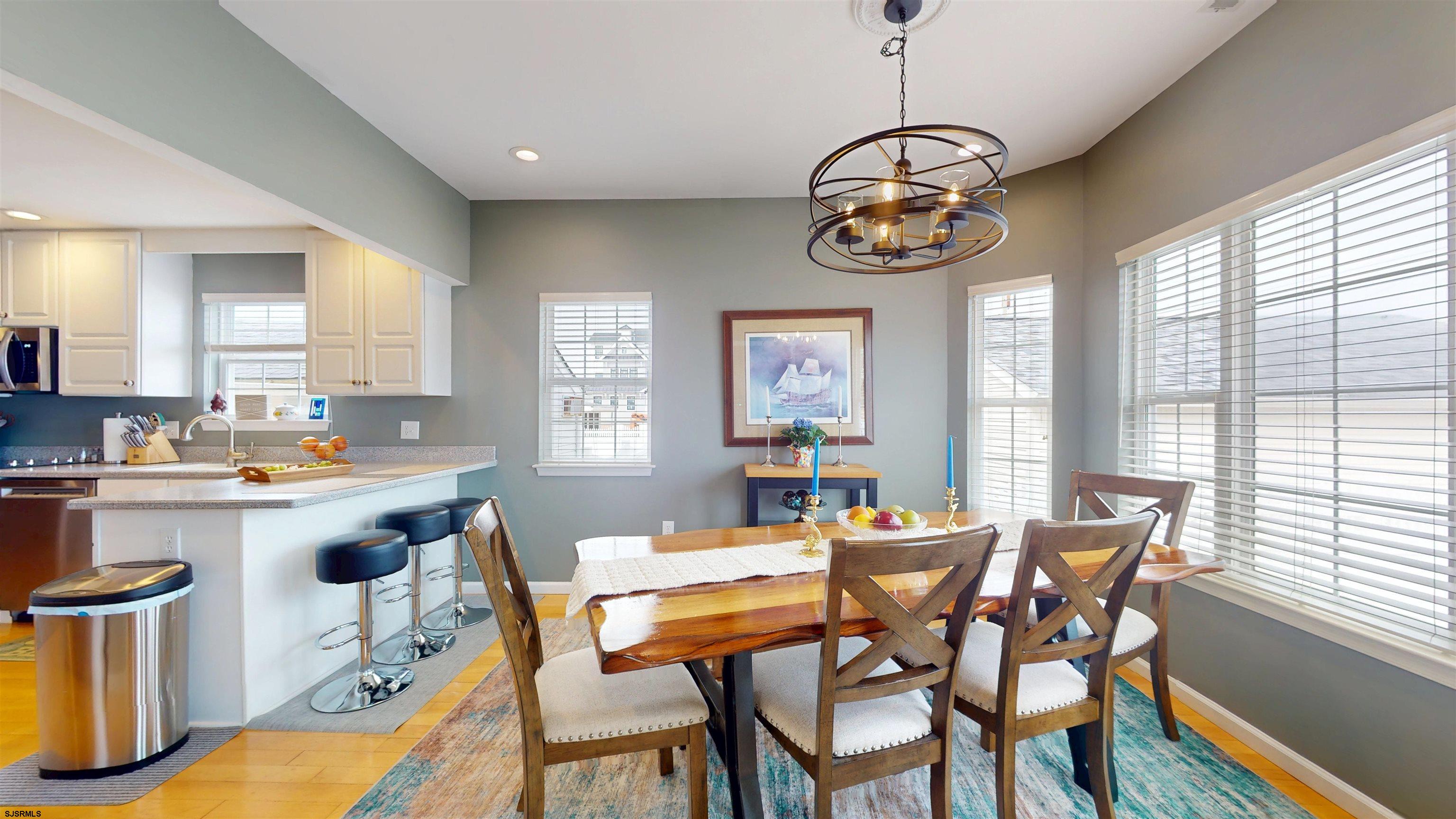 201 25th Street South Brigantine, NJ 08203 - Photo 13 of 60 a view of a dining room with furniture window and outside view