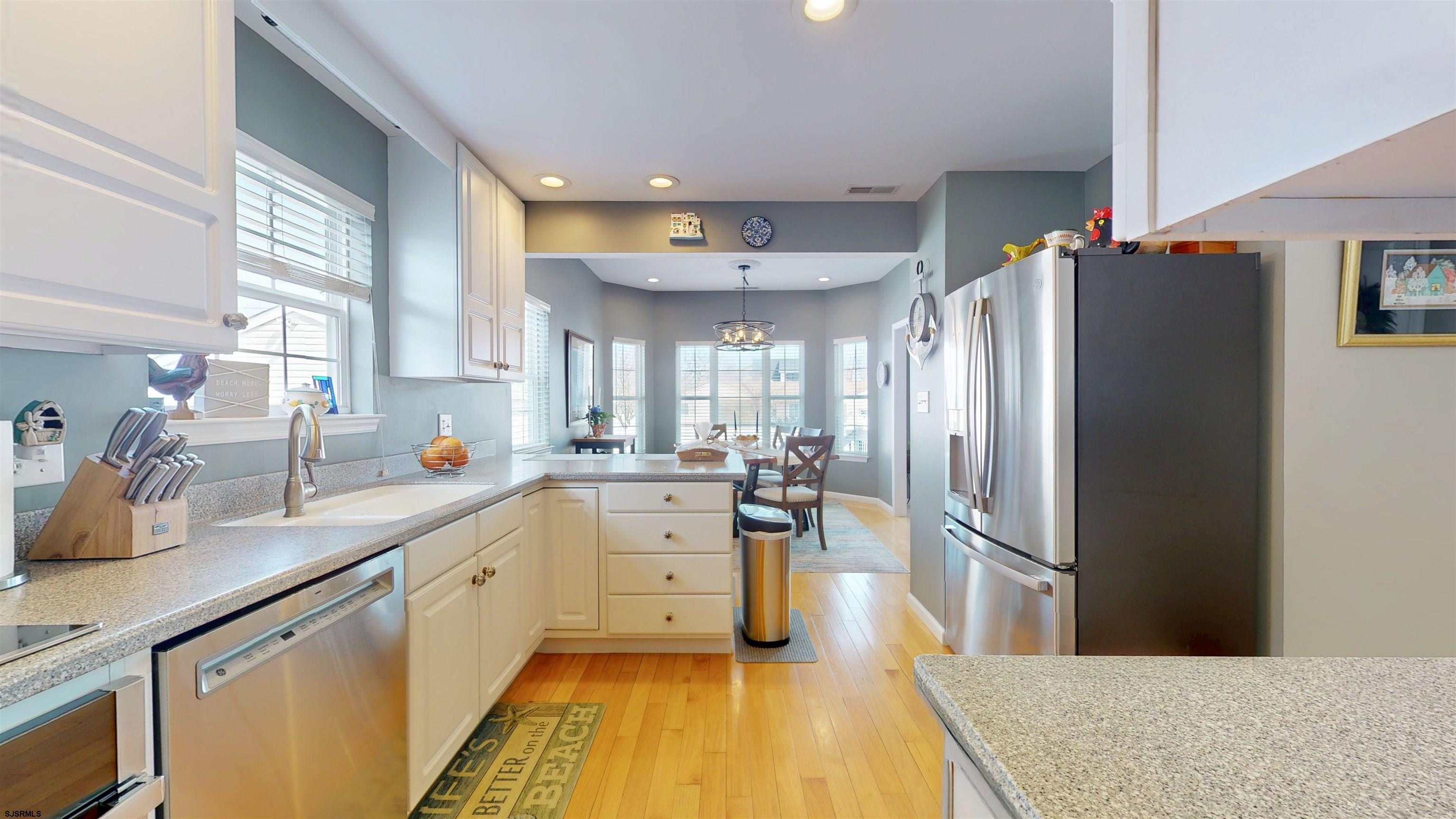 201 25th Street South Brigantine, NJ 08203 - Photo 14 of 60 a kitchen with stainless steel appliances a refrigerator sink and cabinets