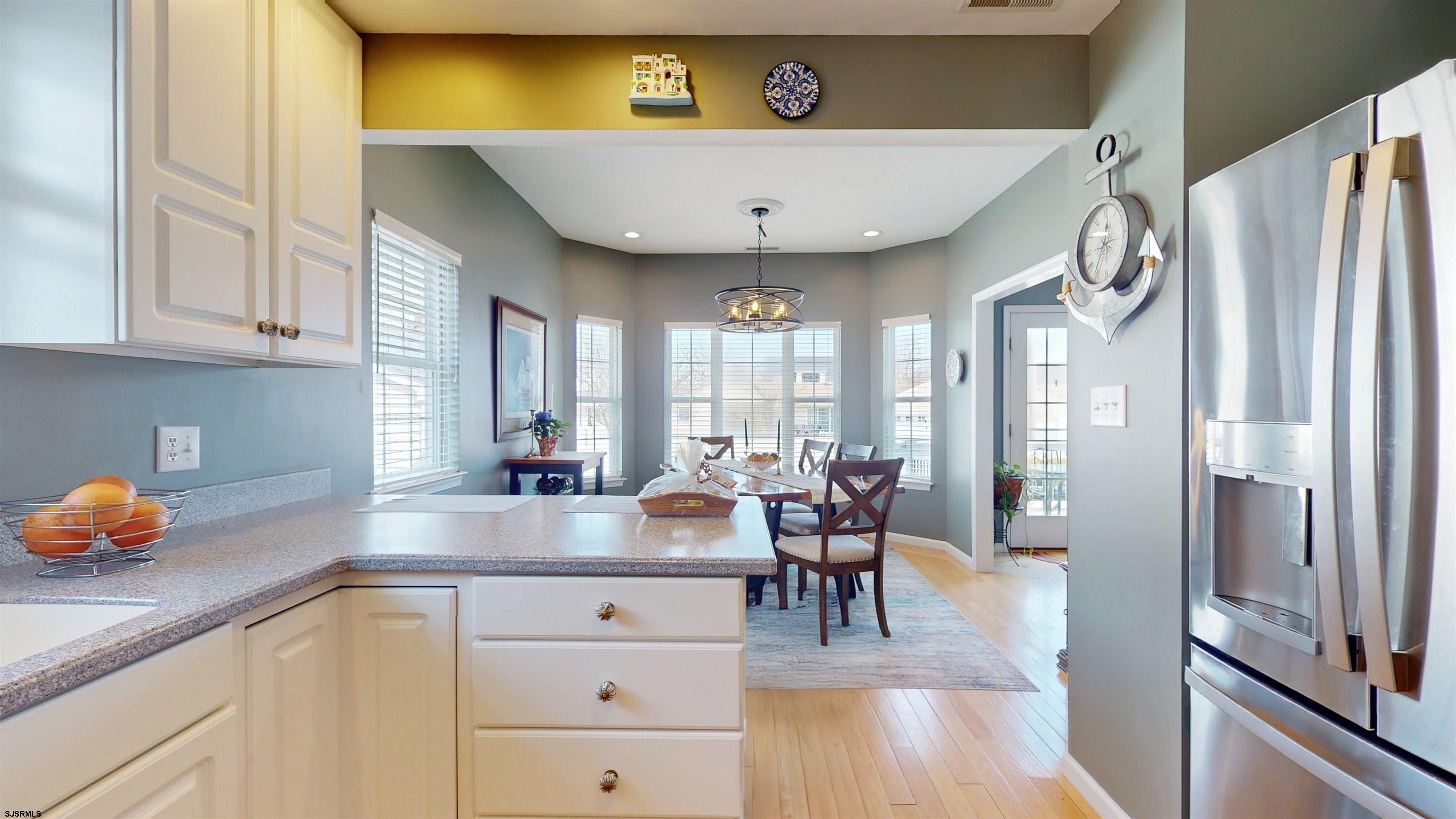 201 25th Street South Brigantine, NJ 08203 - Photo 17 of 60 a view of a kitchen with center island and stainless steel appliances