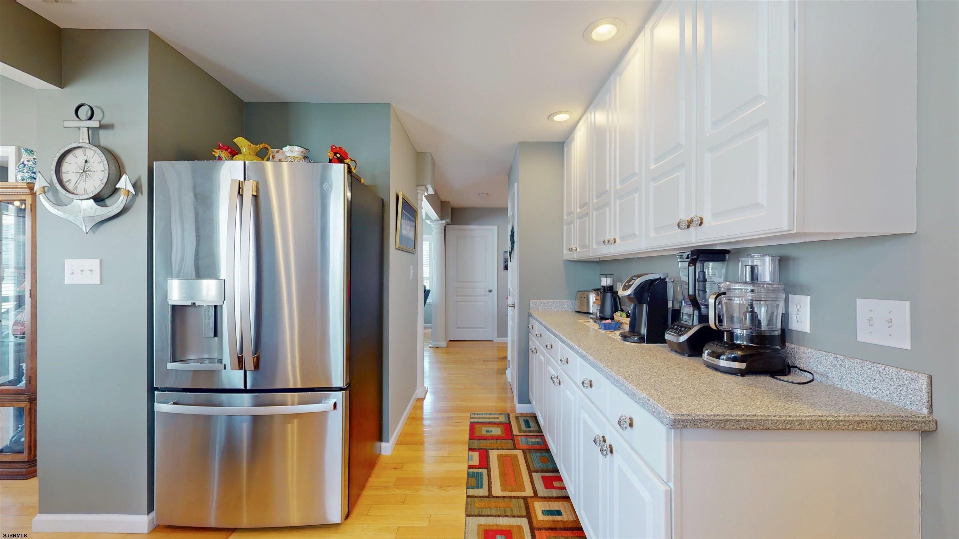 201 25th Street South Brigantine, NJ 08203 - Photo 18 of 60 a kitchen with refrigerator a sink and cabinets
