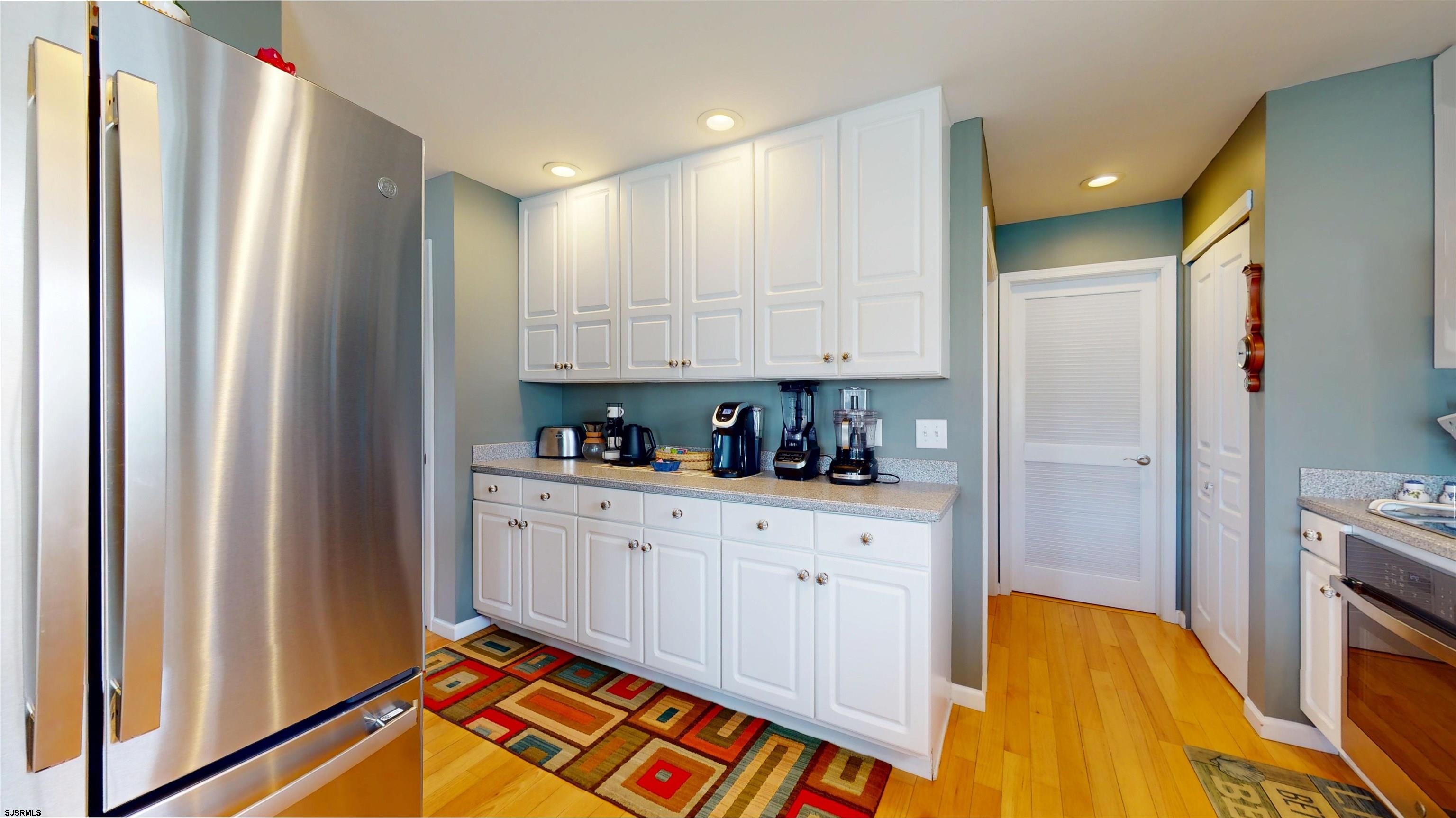 201 25th Street South Brigantine, NJ 08203 - Photo 23 of 60 a kitchen with stainless steel appliances granite countertop a refrigerator and a stove top oven