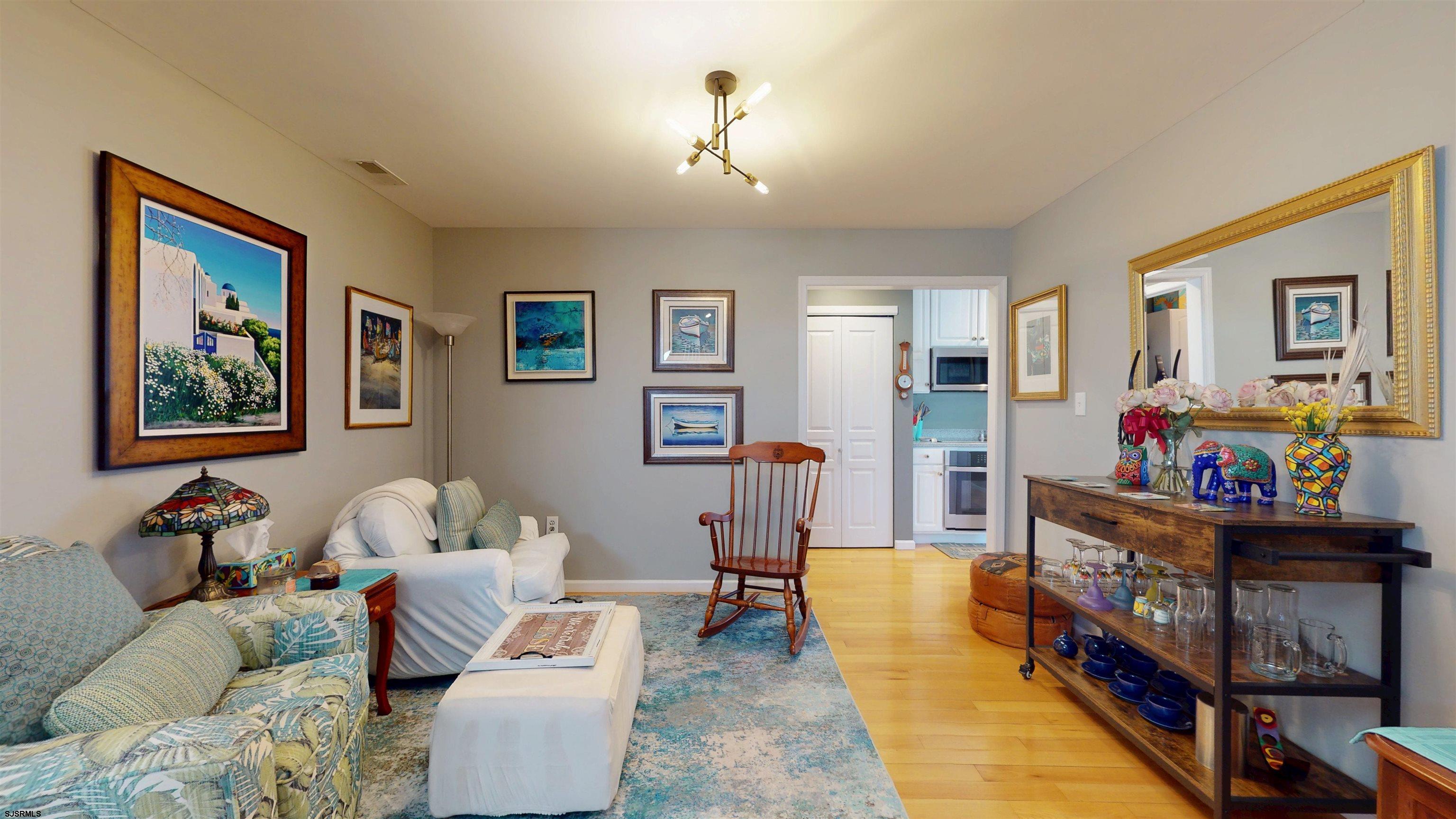201 25th Street South Brigantine, NJ 08203 - Photo 24 of 60 a living room with furniture and baby couch