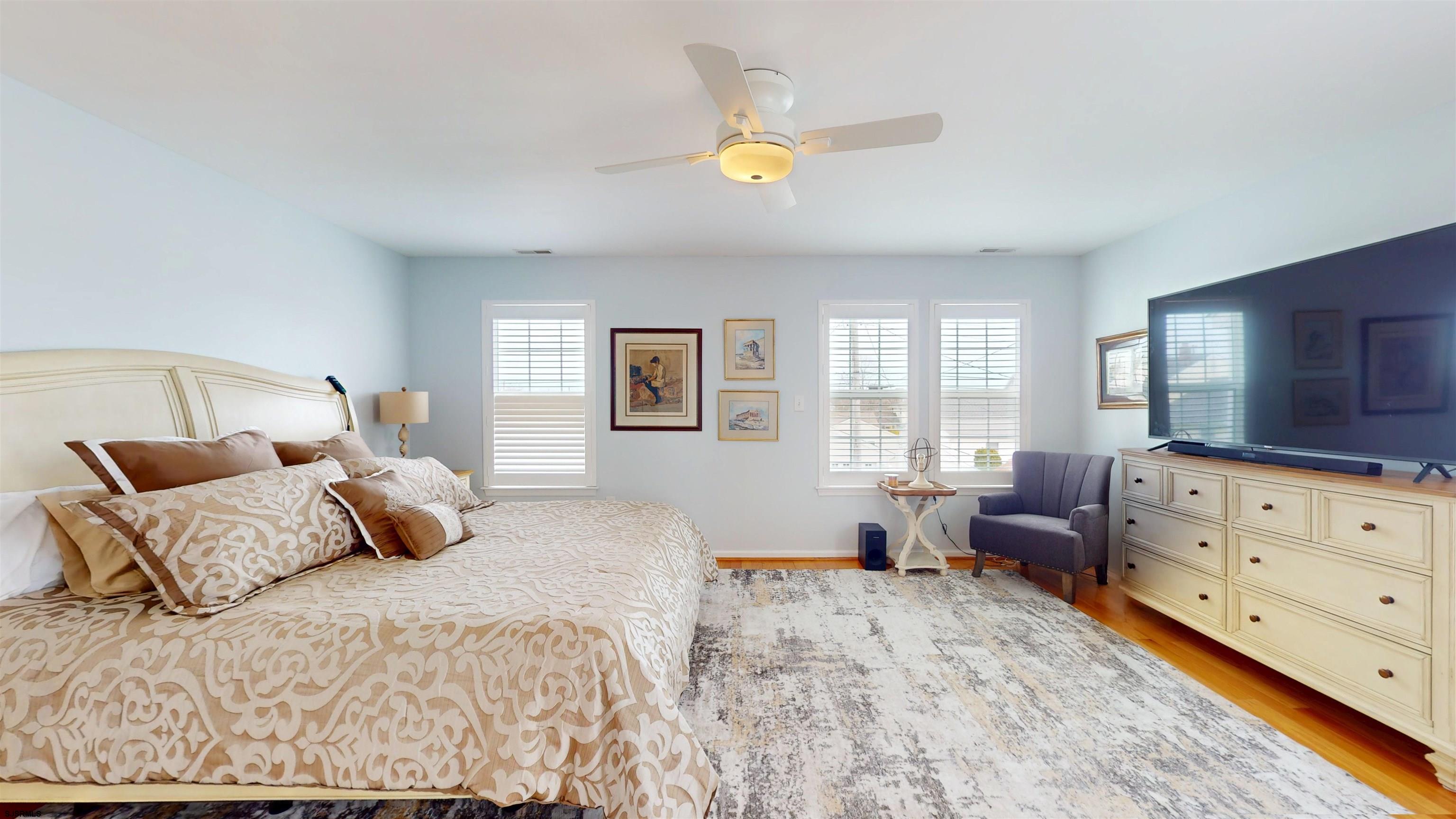 201 25th Street South Brigantine, NJ 08203 - Photo 29 of 60 a bedroom with a bed and window