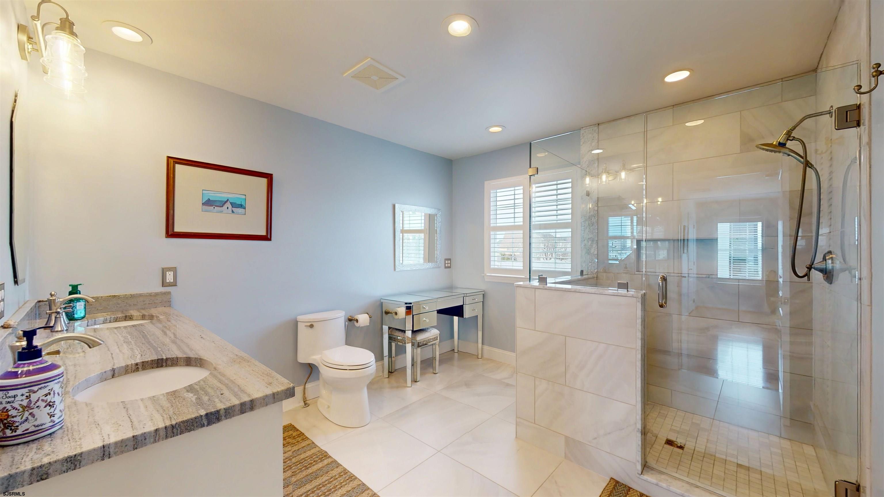 201 25th Street South Brigantine, NJ 08203 - Photo 33 of 60 a living room with furniture and a large window