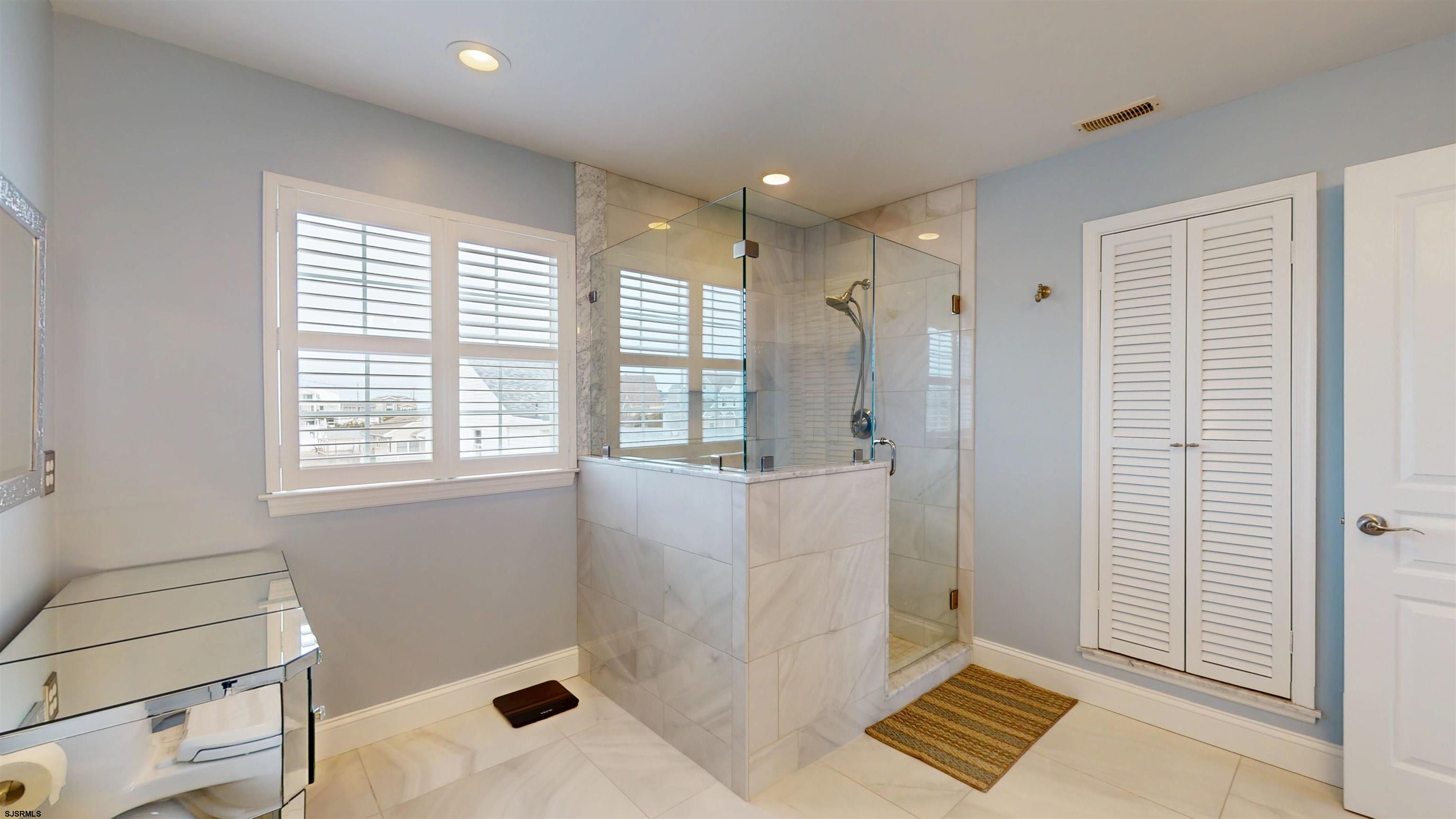201 25th Street South Brigantine, NJ 08203 - Photo 36 of 60 a bathroom with a shower