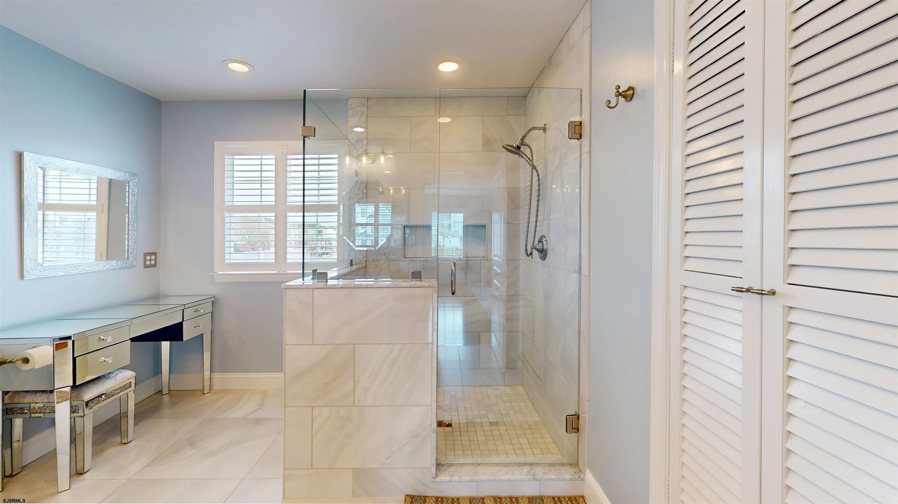 201 25th Street South Brigantine, NJ 08203 - Photo 37 of 60 a bathroom with a shower