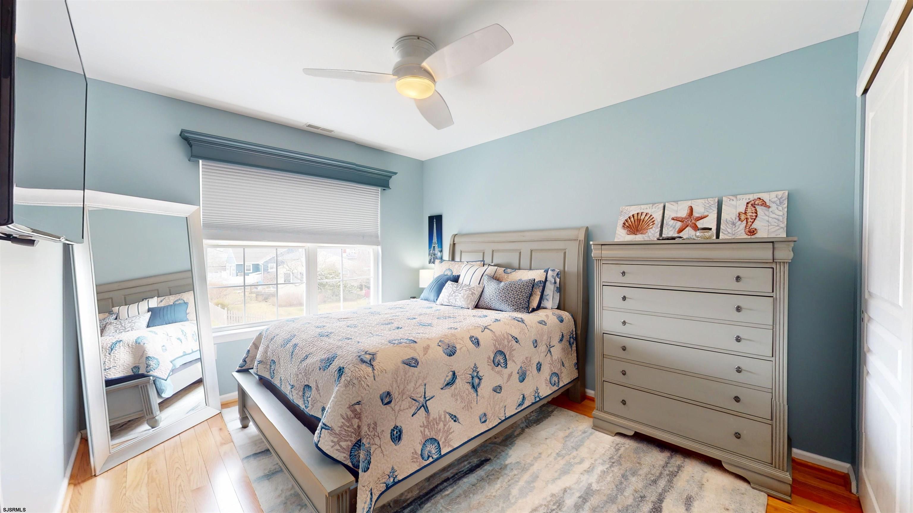 201 25th Street South Brigantine, NJ 08203 - Photo 41 of 60 a bedroom with a bed and a cabinets
