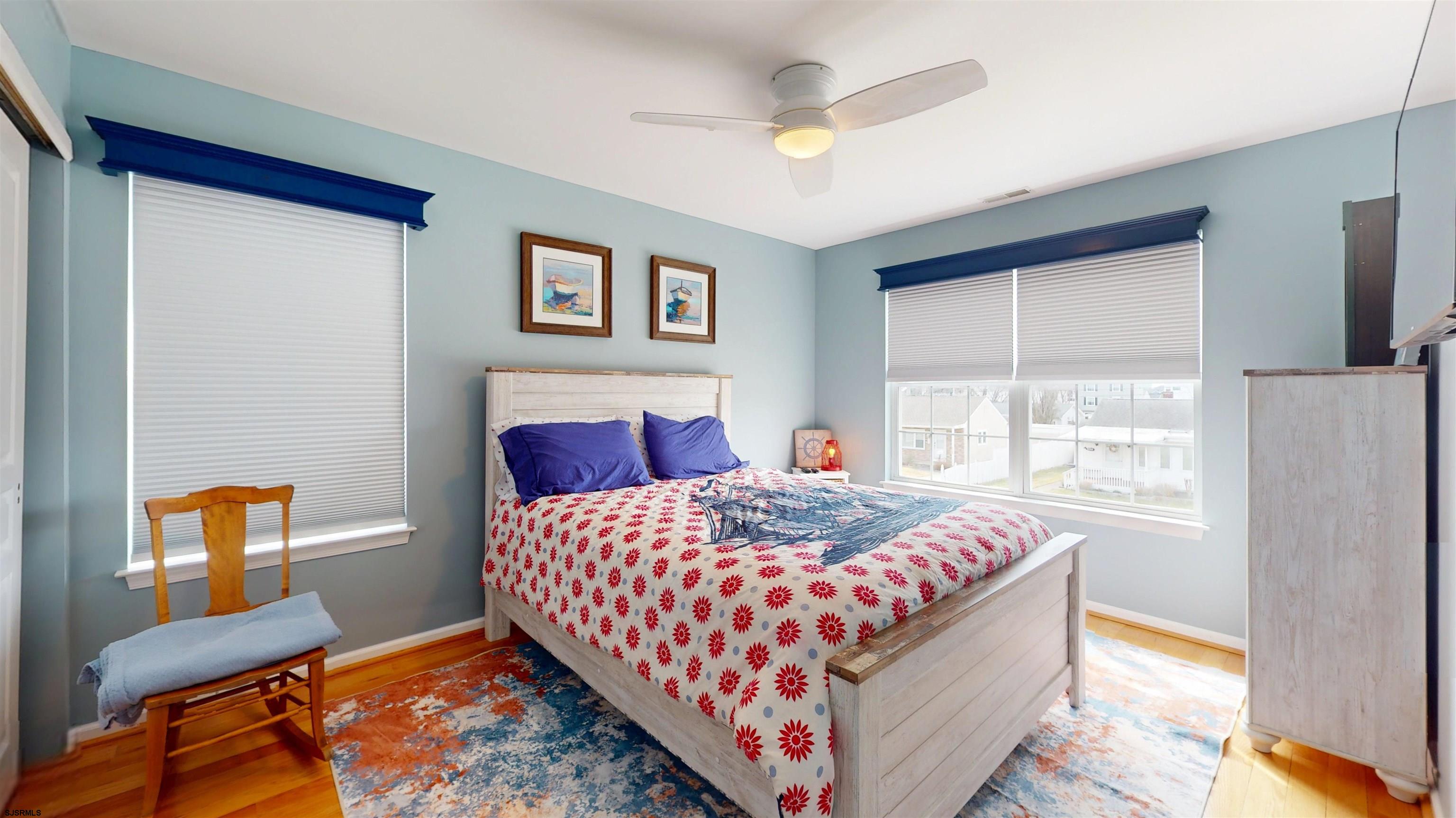 201 25th Street South Brigantine, NJ 08203 - Photo 44 of 60 a bedroom with a bed and a window