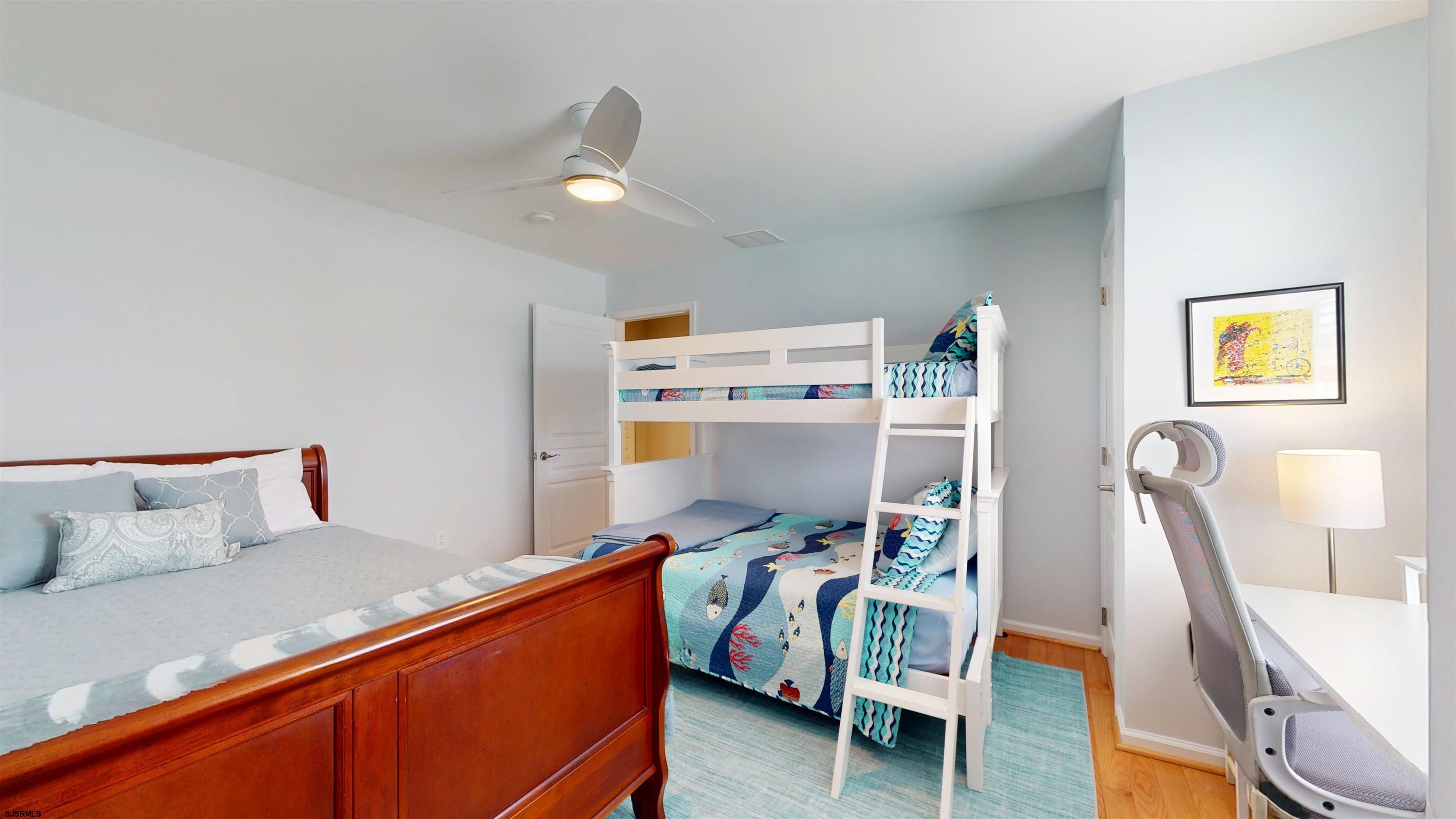 201 25th Street South Brigantine, NJ 08203 - Photo 48 of 60 a bed room with a bed and a chair