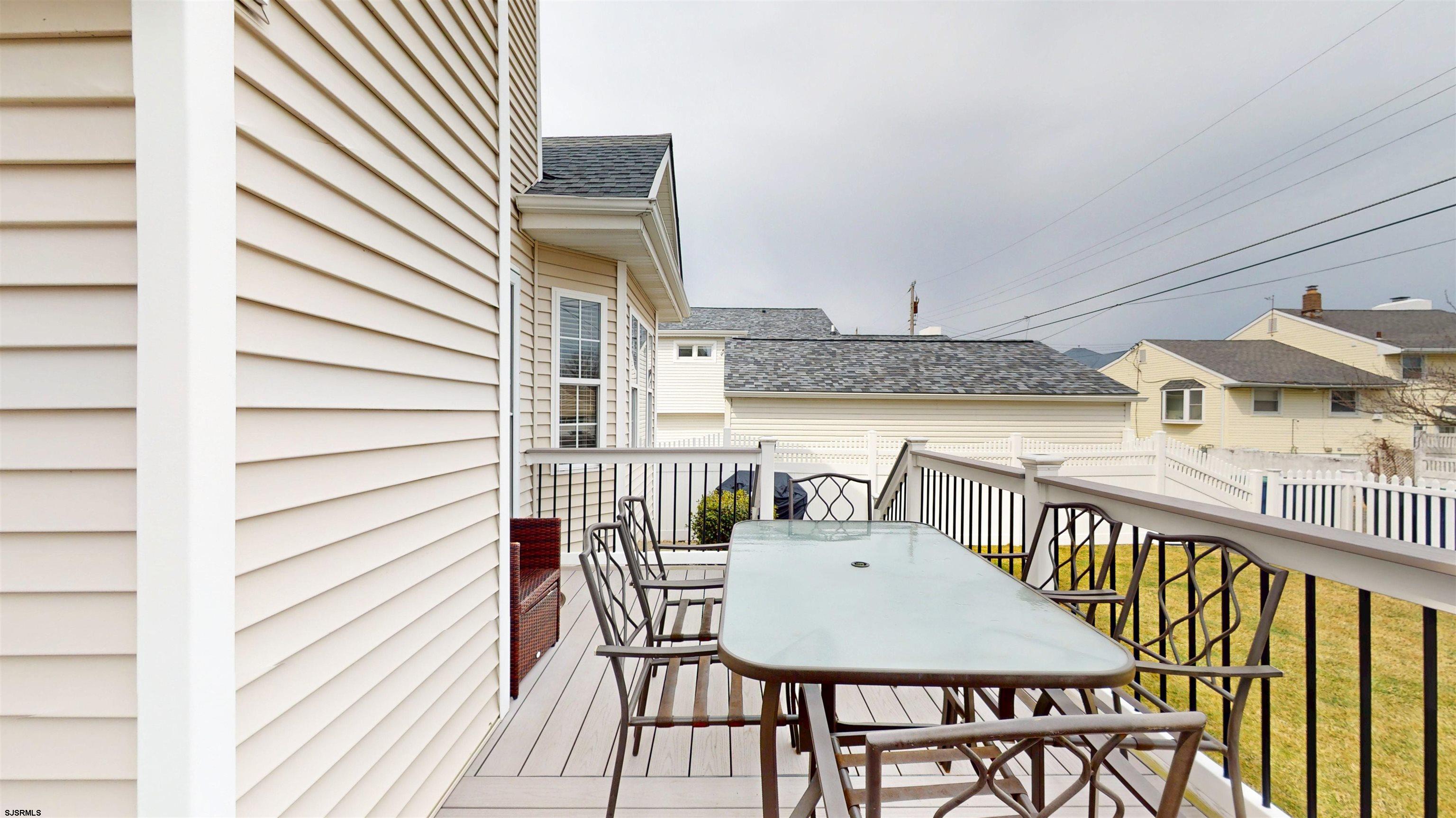 201 25th Street South Brigantine, NJ 08203 - Photo 54 of 60 a balcony with table and chairs