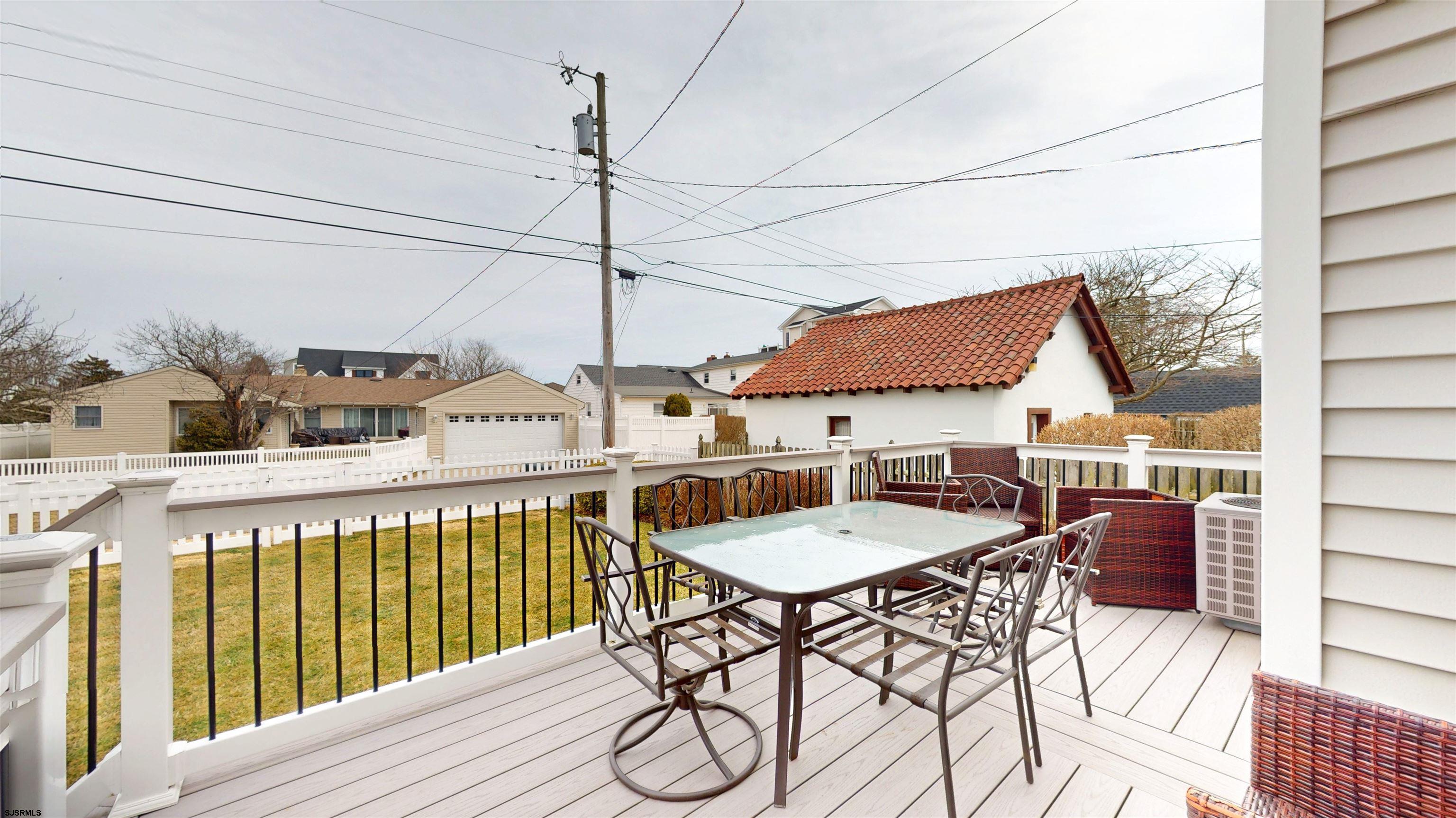 201 25th Street South Brigantine, NJ 08203 - Photo 55 of 60 a view of a patio with a table and chairs