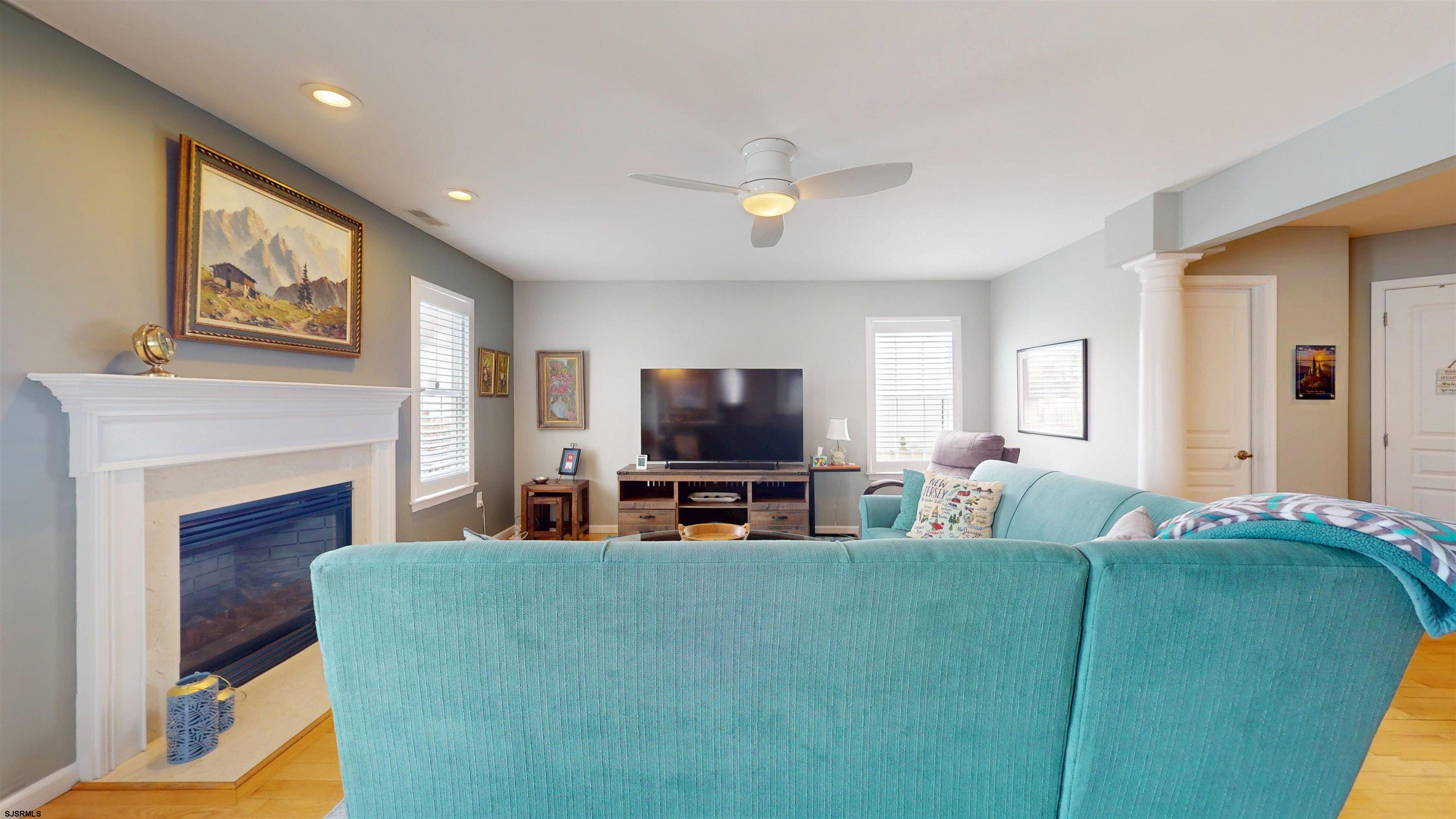 201 25th Street South Brigantine, NJ 08203 - Photo 8 of 60 a living room with furniture and a flat screen tv