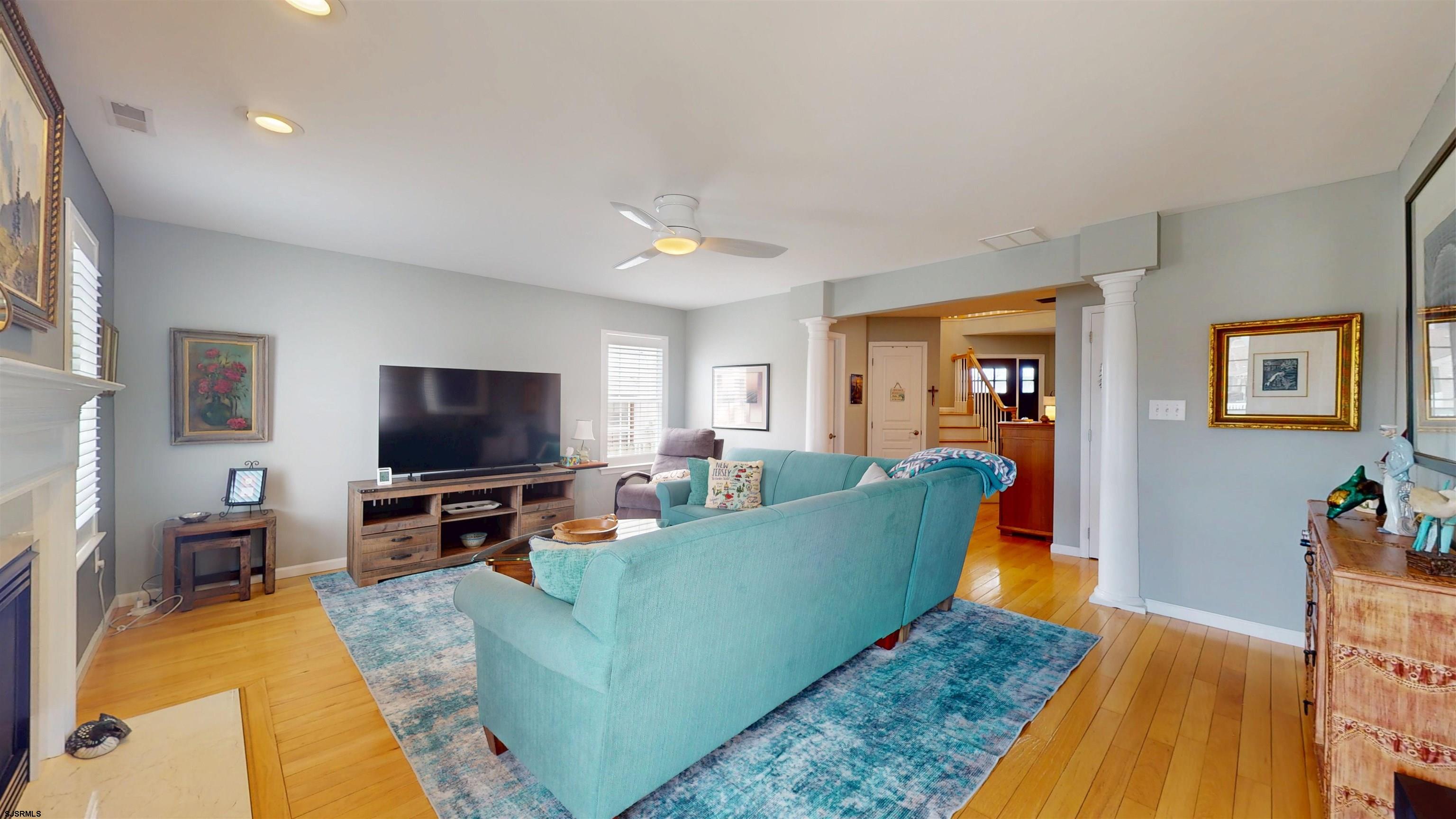 201 25th Street South Brigantine, NJ 08203 - Photo 9 of 60 a living room with furniture and a flat screen tv