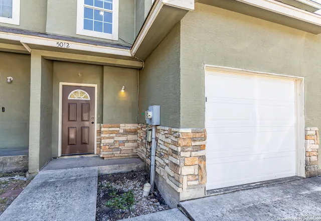 a front view of a house with outdoor space
