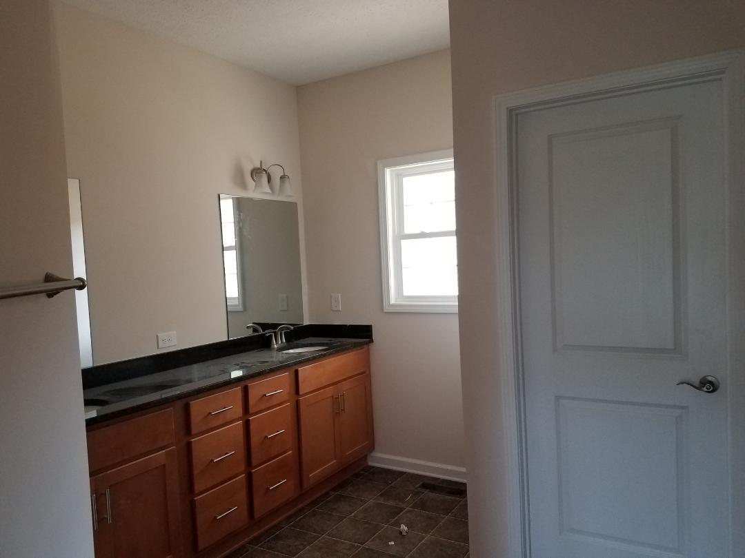 4461 Old Stage Road Radford, VA 24141 - Photo 12 of 21 a bathroom with a granite countertop sink and a mirror