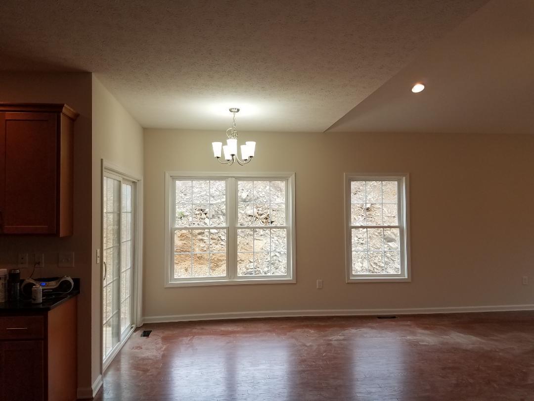 4461 Old Stage Road Radford, VA 24141 - Photo 3 of 21 an empty room with wooden floor and windows