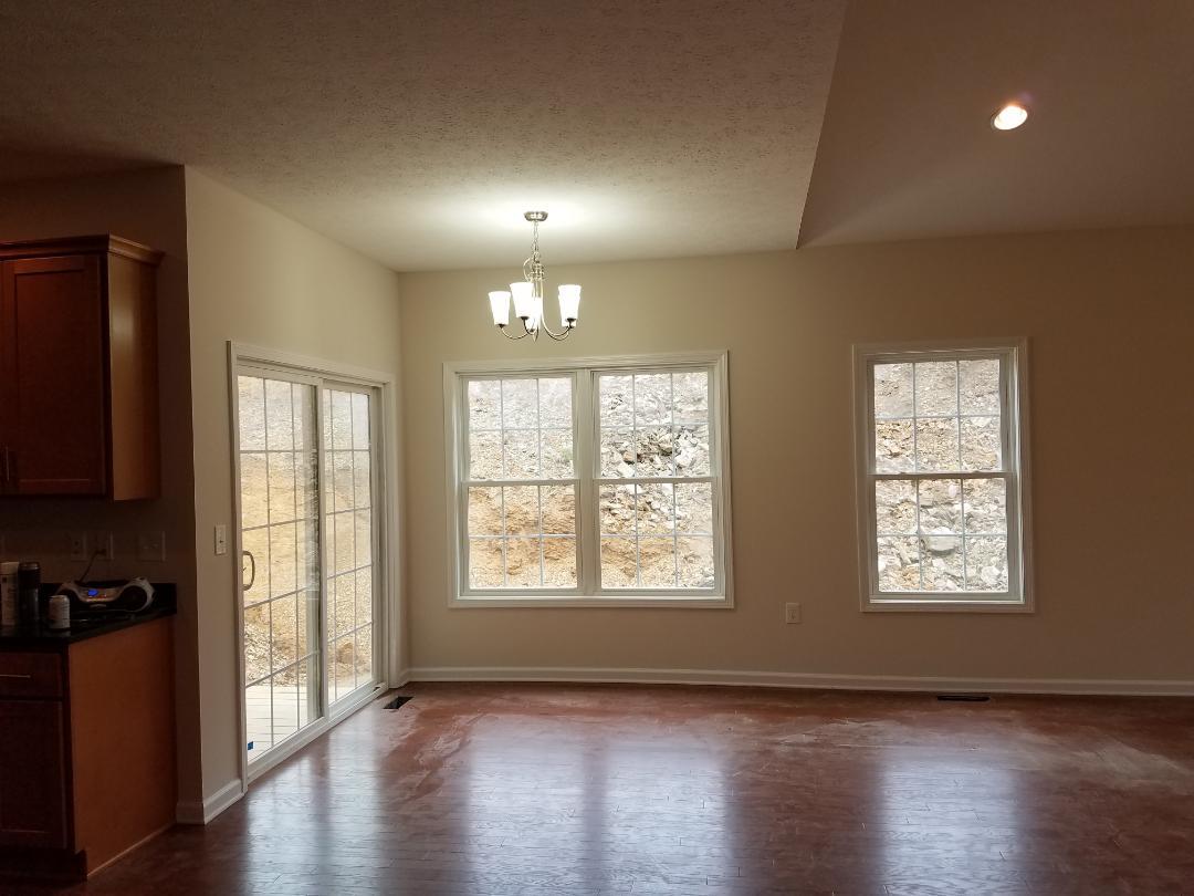 4461 Old Stage Road Radford, VA 24141 - Photo 5 of 21 a view of an empty room with wooden floor and a window