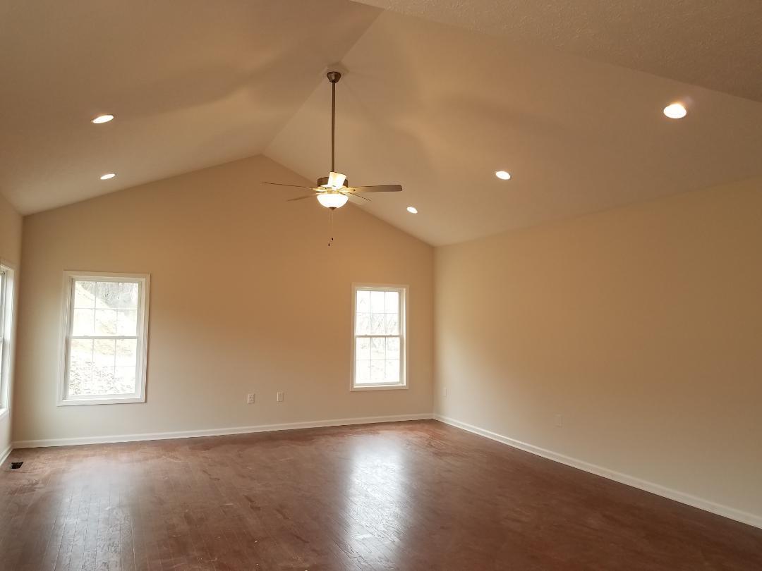 4461 Old Stage Road Radford, VA 24141 - Photo 6 of 21 a view of an empty room with window and wooden floor
