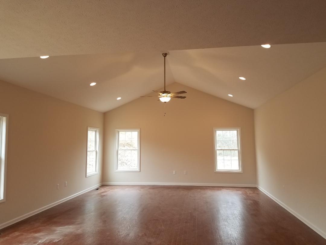 4461 Old Stage Road Radford, VA 24141 - Photo 9 of 21 a view of an empty room with wooden floor and a window