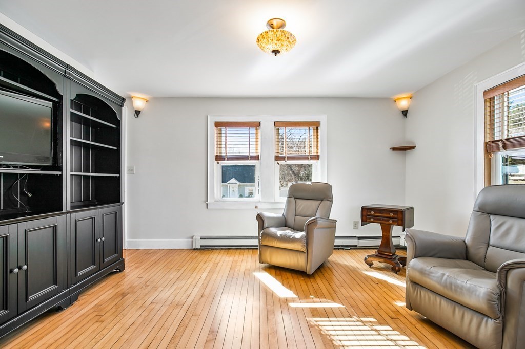 3 Harvey Road Chelmsford, MA 01824 - Photo 19 of 39 a living room with furniture and a rug