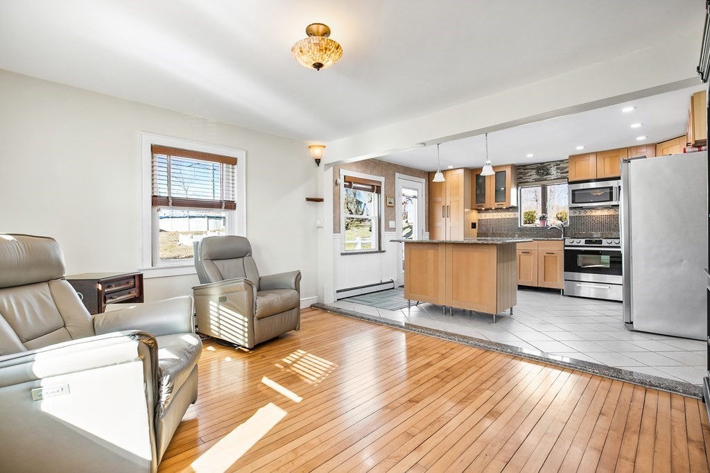 3 Harvey Road Chelmsford, MA 01824 - Photo 23 of 39 a living room with stainless steel appliances furniture and a kitchen view