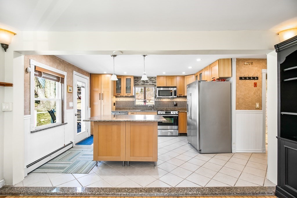 3 Harvey Road Chelmsford, MA 01824 - Photo 24 of 39 a kitchen with stainless steel appliances granite countertop a refrigerator a stove a sink and dishwasher