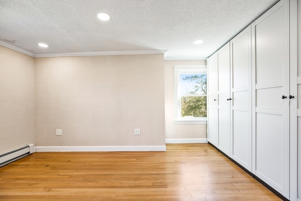 3 Harvey Road Chelmsford, MA 01824 - Photo 32 of 39 a view of an empty room with wooden floor and a window