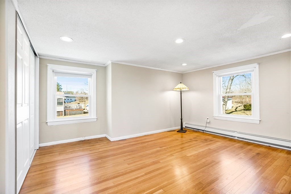 3 Harvey Road Chelmsford, MA 01824 - Photo 35 of 39 a view of empty room with a window and wooden floor