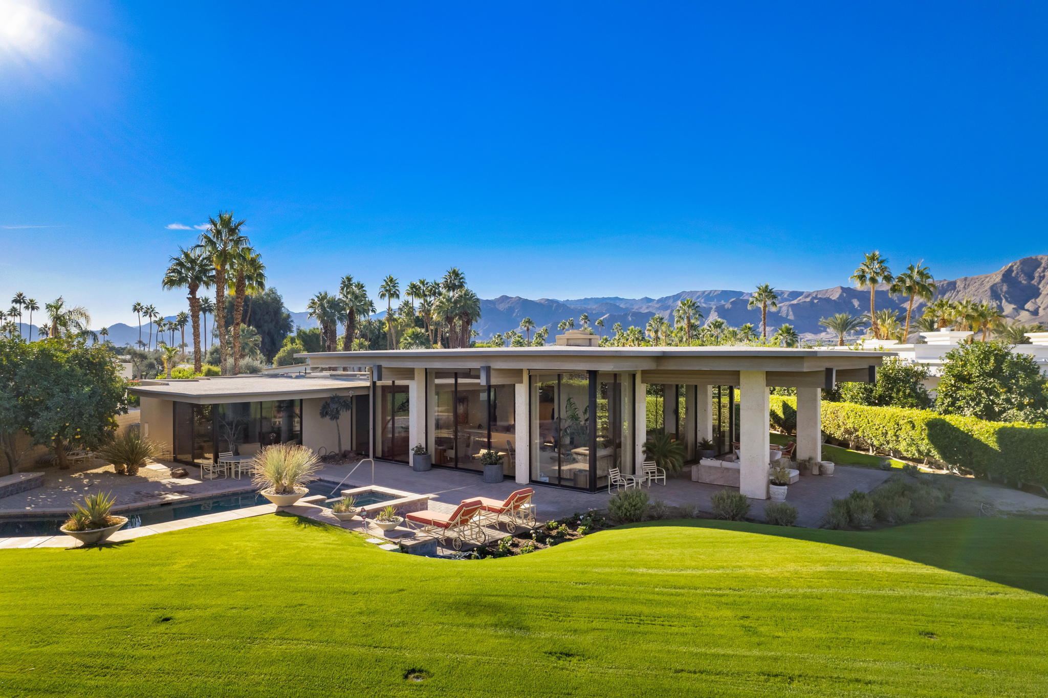71094 La Paz Road Rancho Mirage, CA 92270 - Photo 3 of 38 a view of a house with swimming pool and porch with furniture