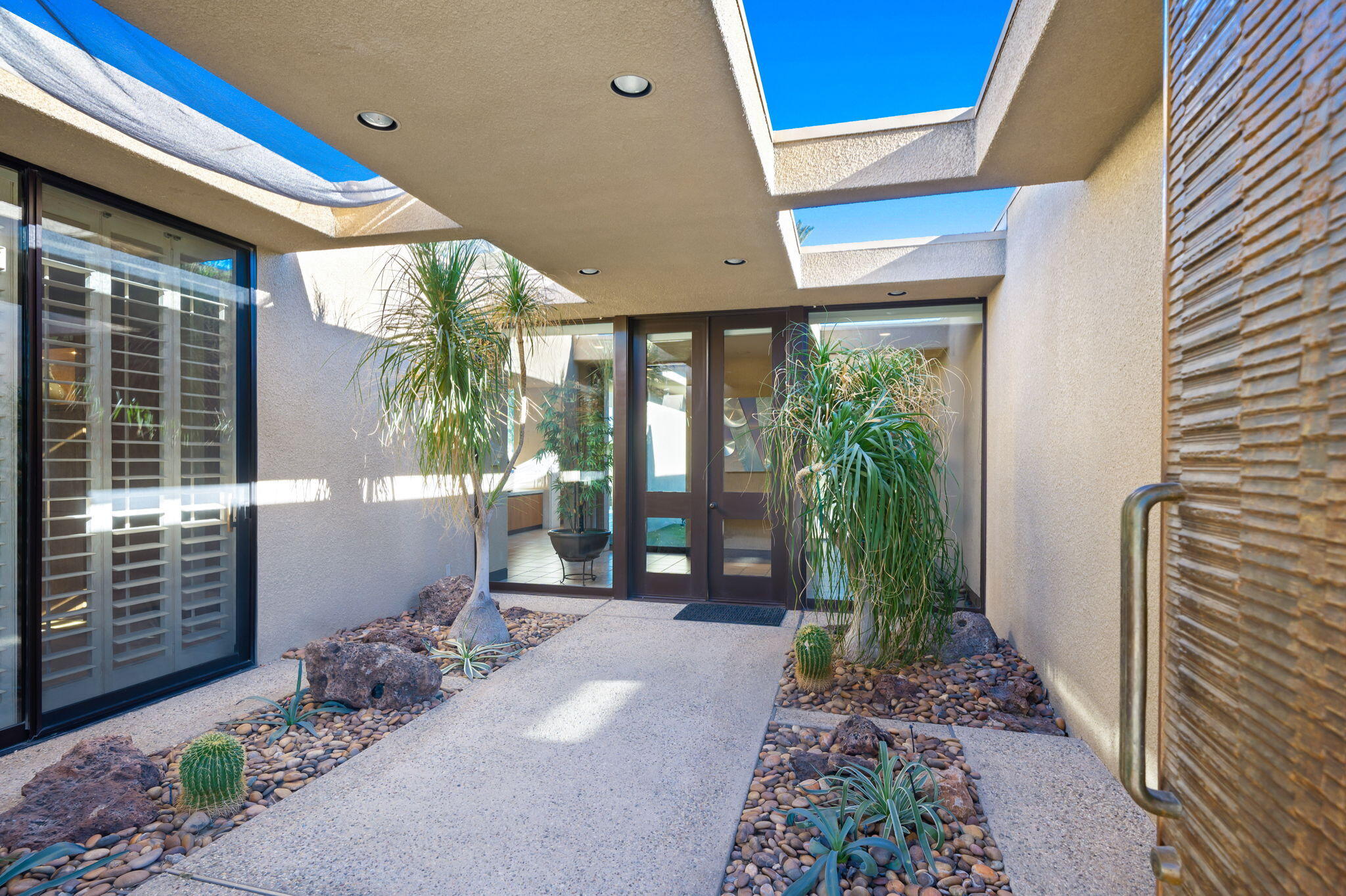 71094 La Paz Road Rancho Mirage, CA 92270 - Photo 4 of 38 a front view of a house with a yard