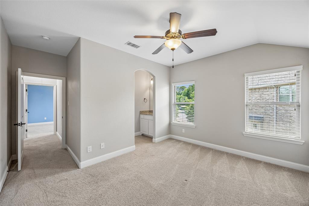 134 Santa Rosa Way Irving, TX 75062 - Photo 24 of 26 Well-appointed bedroom featuring a private vanity area and a spacious layout.