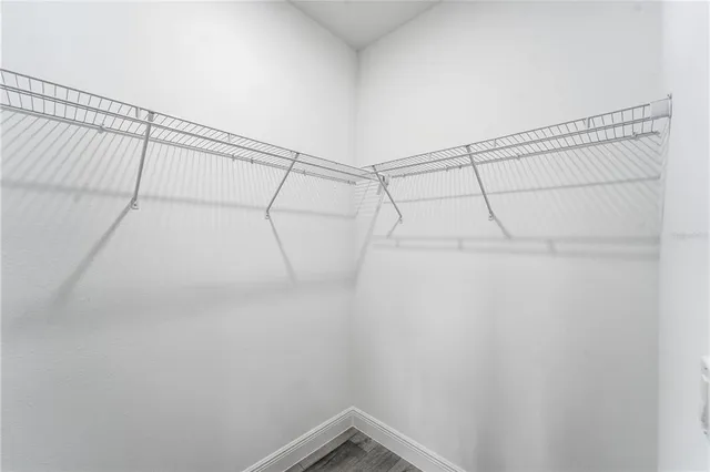 a bathroom with a toilet sink and shower