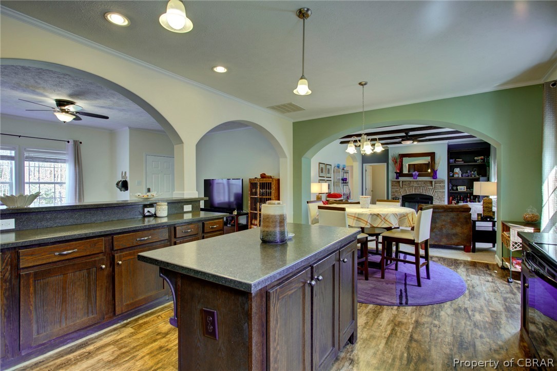 1496 Elsom Mascot Road Mattaponi, VA 23110 - Photo 12 of 33 a kitchen with a sink cabinets and wooden floor