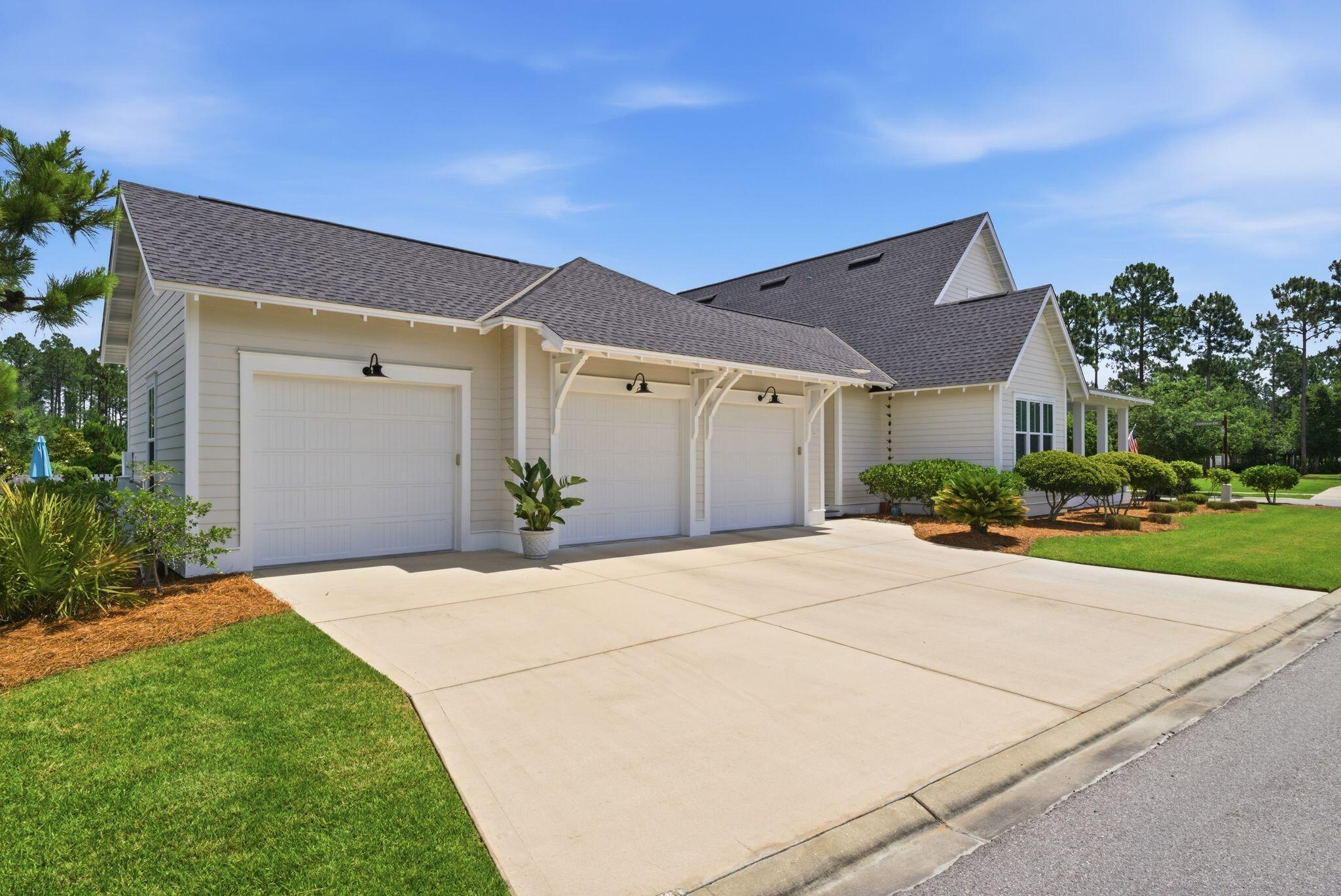 133 Sandchase Circle, Unit LOT 15 Inlet Beach, FL 32461 - Photo 3 of 47 a backyard of a house with plants and trees
