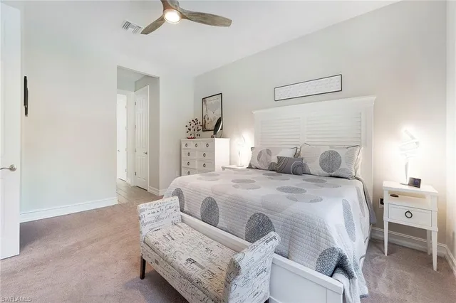a spacious bathroom with a double vanity sink and a mirror