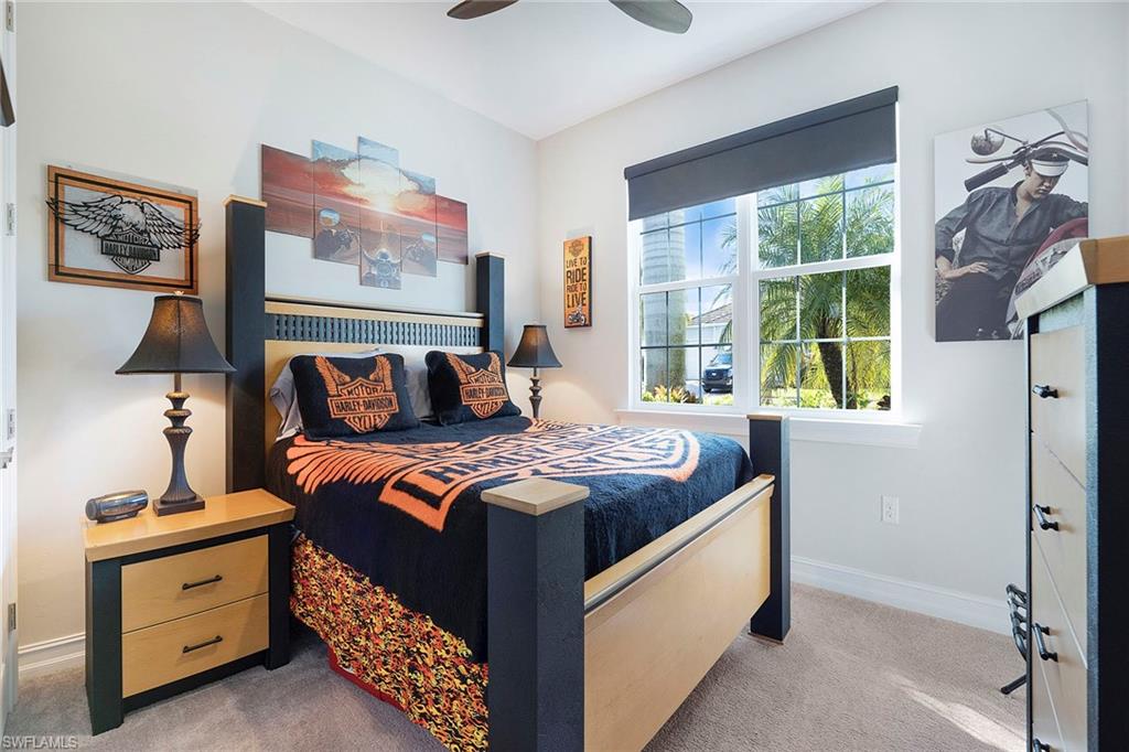 14534 Kelson Circle Naples, FL 34114 - Photo 20 of 50 a bedroom with a bed and a window