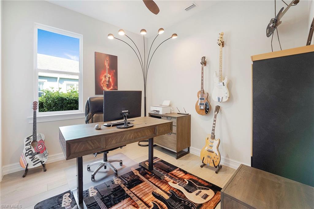 14534 Kelson Circle Naples, FL 34114 - Photo 22 of 50 a workspace with furniture and window