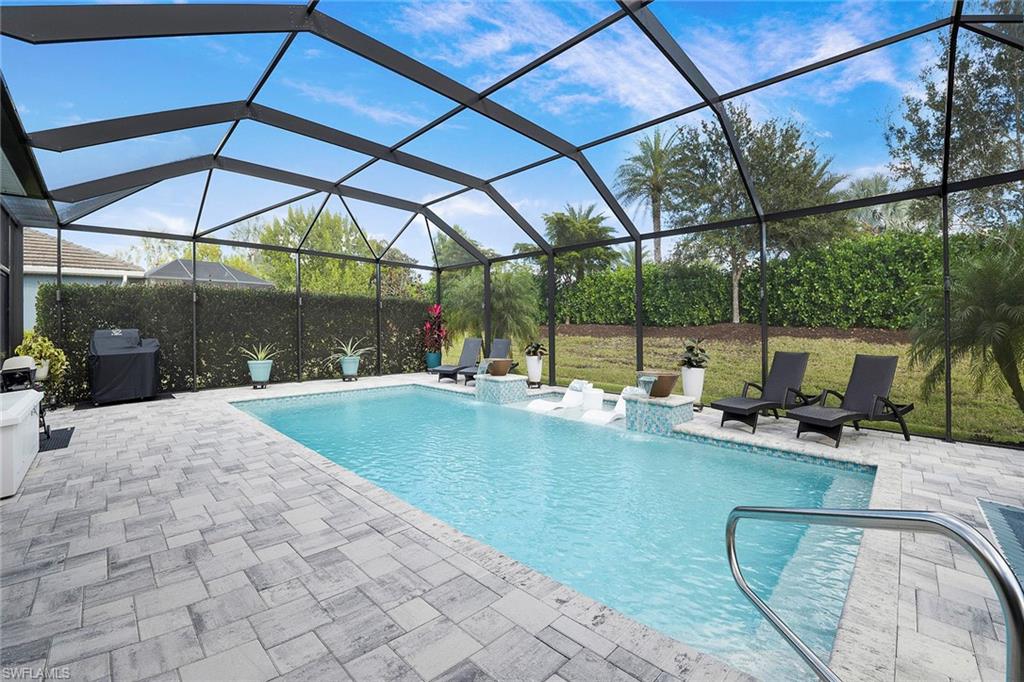 14534 Kelson Circle Naples, FL 34114 - Photo 27 of 50 a view of a swimming pool with a patio