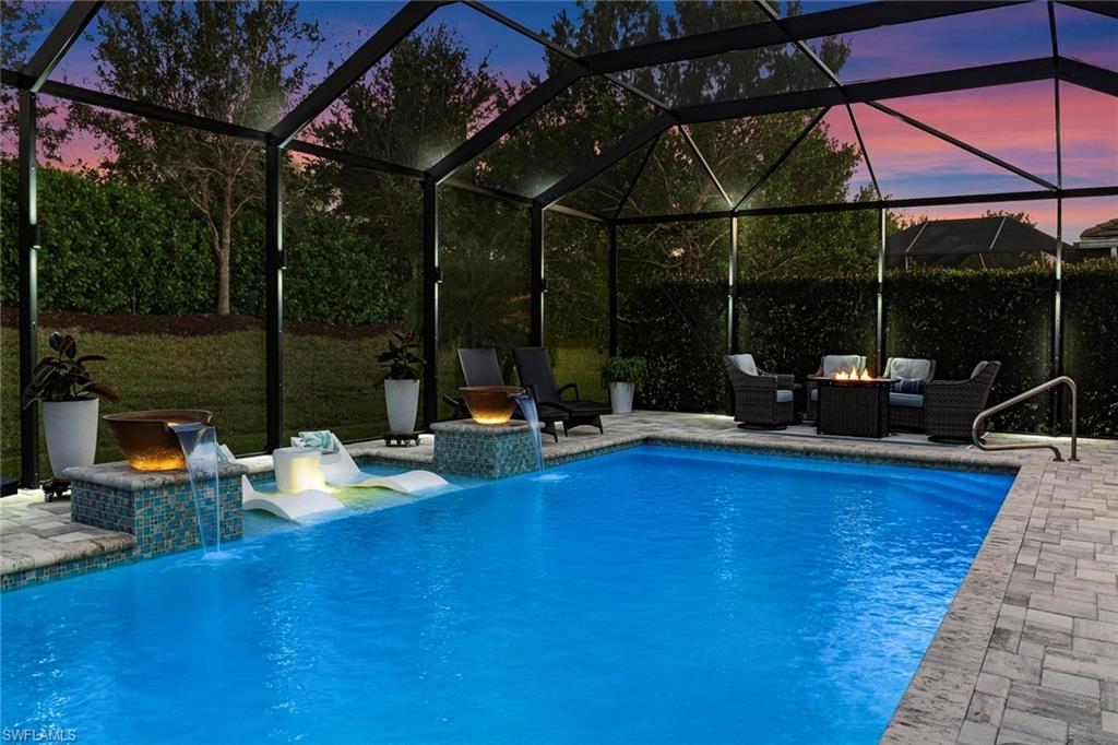 14534 Kelson Circle Naples, FL 34114 - Photo 34 of 50 a view of a patio with table and chairs potted plants with wooden floor and fence