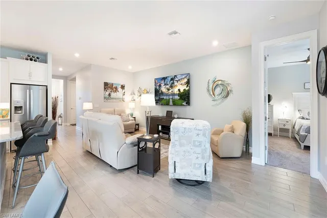 a kitchen with stainless steel appliances a stove refrigerator sink and microwave