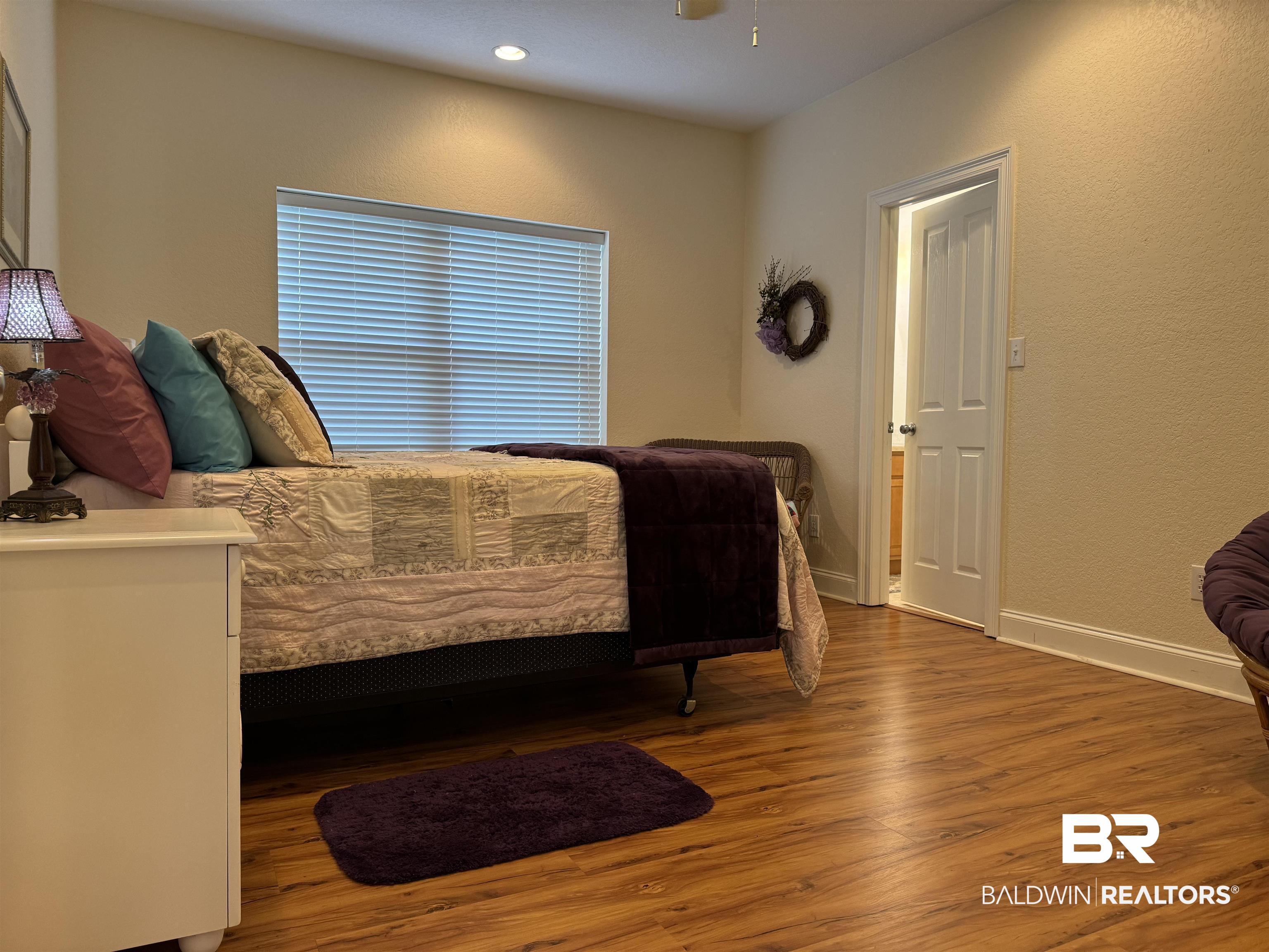 7544 Wenzel Road, Unit B6 Foley, AL 36535 - Photo 11 of 15 Bedroom with hardwood / wood-style floors