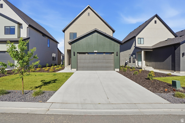 11531 Engelmann Drive Draper, UT 84020 - Photo 29 of 31 Contemporary exterior with a dark green facade and a contrasting light-colored stucco finish